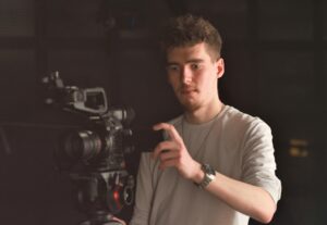 Digital Media Producer Jack Yewman using a camera.