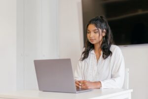 A female student using a laptop.